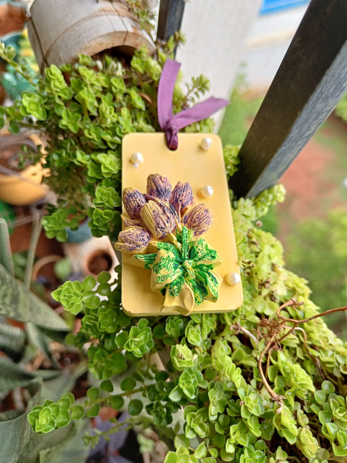 Yellow rectangular hanging aroma stone with purple and green flowers